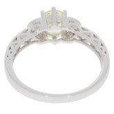 View of the back of a Green Peridot 14K White Gold Ring showcasing intricate design and diamond accents.